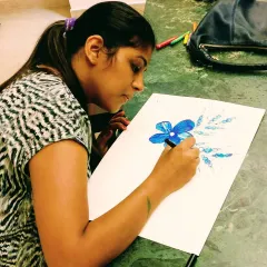 A moment of quiet concentration as a student sketches a floral design. My studio is a place to unwind and express your unique perspective.