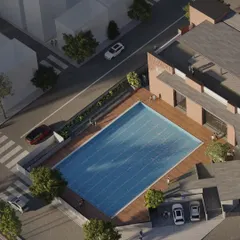 For the KMYF Rehabilitation Center, the site plan was a critical challenge. This bird's-eye view shows how we organized the building, parking, and a large public swimming pool on an irregular plot to create a functional and accessible community asset.