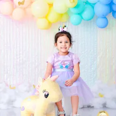 In our Unicorn Dreams theme, we use pastel rainbow colors, fluffy clouds, and of course, a friendly unicorn. This setup is perfect for capturing the magic of childhood for your little dreamer.