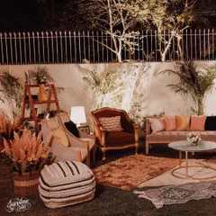 For a 50th anniversary with a "Vintage Romance" theme, I created this warm and inviting lounge area. The mix of velvet and wood furniture, pampas grass, and soft lighting created a nostalgic and elegant atmosphere.