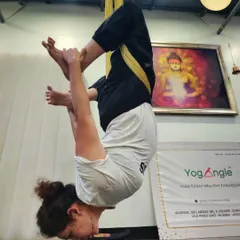 For more experienced students, we explore dynamic and challenging inversions. This pose requires significant core strength and flexibility, demonstrating the progressive nature of our aerial yoga practice.
