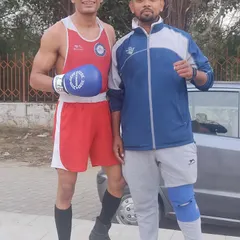 With gold medalist Jasvinder Singh after his win at the 43rd Delhi State Boxing Championship in 2022. His performance is a direct result of relentless training and focus.