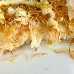 The aftermath of enjoying our delicious Turkish Cream Kunafa. The flaky pastry and creamy center create a texture that is simply irresistible.