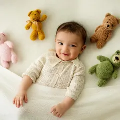Tucked in with some furry friends. This sweet and cozy setup with teddy bears is a classic way to create an adorable and heartwarming baby portrait.