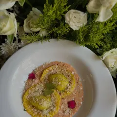 Our Spinach & Ricotta Ravioli, served in a delicate Pink a la Vodka sauce and plated with care. A comforting yet sophisticated choice.