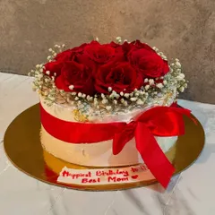 This cake is designed to look like a beautiful bouquet of fresh red roses and baby's breath. It's a wonderfully romantic gesture for an anniversary, Valentine's Day, or a mother's birthday.