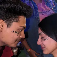 A cool and edgy concept for a couple: "Stay Wild" painted on their faces for a powerful photo.