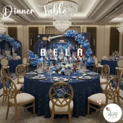A full view of the guest dining area, where every table is themed. The starry blue tablecloths, matching chair decor, and view of the main stage ensure an immersive experience from every seat in the room.