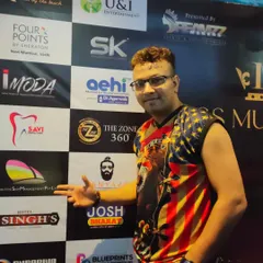 Posing in front of the sponsor wall at a major event. I'm experienced in performing at high-profile corporate and entertainment functions.