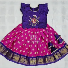 This newborn pattu pavadai is ready to dispatch. The combination of purple and pink with a traditional gold border is a timeless choice for little ones.