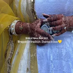 Wrapped in tradition and stained in love. The deep, beautiful color of the henna complements her entire bridal look, proving that a perfect stain is the ultimate accessory.