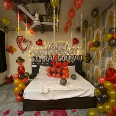 Another perspective of the complete anniversary room decoration. I use a mix of colors and elements to fill the space and ensure the surprise feels grand and thoughtful.