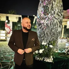 Keep it real. A candid shot of me at an event, standing next to a cool mirrored lion statue, just taking in the atmosphere.