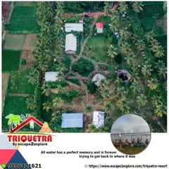 An aerial view of our complete property, showcasing the different buildings, green fields, and the nearby lake.