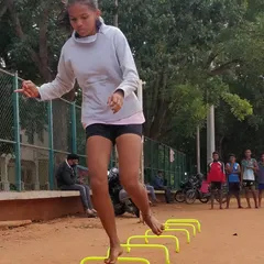 Here, one of our dedicated athletes performs barefoot plyometric jumps over hurdles. Training on the natural ground like this builds stronger feet and ankles, giving you a solid and more resilient foundation.