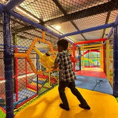 A young explorer navigates one of the many fun obstacles in our play maze. Each path offers a new challenge to keep children engaged and physically active.
