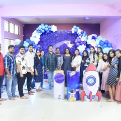 The full 12th batch celebrating a student's birthday with a space-themed decor they created themselves. We make sure to celebrate every small and big moment together.