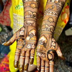 The completed personalized mehandi, showing the name 'Sunil' beautifully integrated with birds, elephants, and other classic elements.