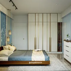 A closer look at a custom wardrobe with elegant white and gold-trimmed doors. This design focuses on vertical space, offering a mix of hanging and folded storage that is perfect for keeping a modern bedroom organized and serene.