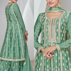 This green Chinon silk palazzo suit is all about sophisticated charm. The top has heavy thread embroidery, and the flowy palazzo pants make it super comfortable yet dressy.