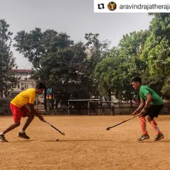 A powerful action shot of two of our players in a one-on-one battle, capturing the intensity and spirit of grassroots hockey.