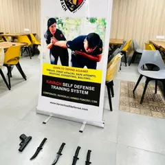 Our training setup for a corporate workshop, featuring training knives and firearms to prepare participants for real-world weapon threats.