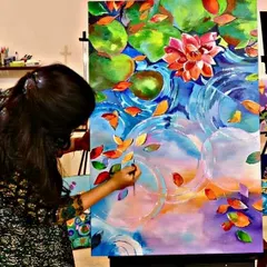 It's never too late to find your inner artist. This student is creating a beautiful, vibrant lotus pond painting, finding her moment of peace and focus in my adult art class.
