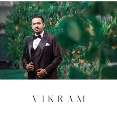 A handsome portrait of the groom in his reception tuxedo, ready to celebrate with his new bride.