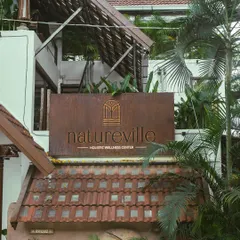 Our new sign for Natureville Holistic Wellness Center. We are dedicated to introducing the innovative concept of whole, unrefined plant-based foods and offering a diverse range of healing services to the Bangalore community.