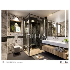 For this New Delhi residence, we designed a washroom with a dramatic interplay of textures. The shower area is clad in dark, heavily veined marble, creating a stunning focal point, while the floating wooden vanity adds a touch of organic warmth.