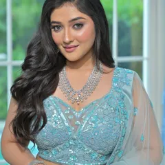 A full-length view of this gorgeous light blue lehenga and diamond-look jewellery set. It's a perfect combination for a summer wedding or a daytime reception.