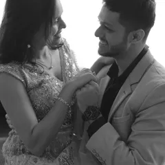 A happy, interactive moment between the couple, captured in beautiful monochrome.