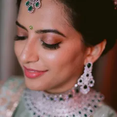 A close-up look at my soft glam technique. Notice the clean, defined eye makeup with natural-looking lashes and the smooth, dewy skin finish. I believe in enhancing your features without masking them, ensuring you look and feel beautiful.