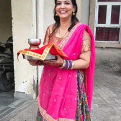 The joy of Karwa Chauth! I created a classic festive look with a pink and gold theme to match her beautiful outfit.