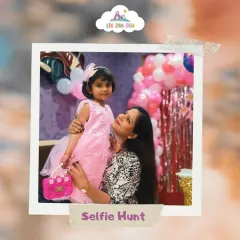 Join our tiny smiles selfie hunt! This adorable mother-daughter duo captures a sweet moment during a party. We love seeing you make memories here.
