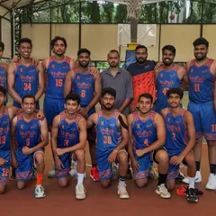 The senior men's team huddle before a game at the 2024 State 'B' Division League.