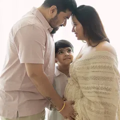There is a sacred stillness when a family pauses to listen. Here, a big brother-to-be looks up with wonder as his parents share a quiet moment, their heads bowed together in love and anticipation. These natural light family maternity sessions are about capturing the connections that are already there.