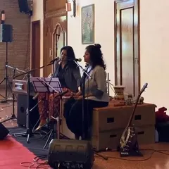 Performing with my dear friend Bindhumalini at a 'Threshold' event. We often perform as a duo, blending our voices and instruments to create a unique sound for private and community events.