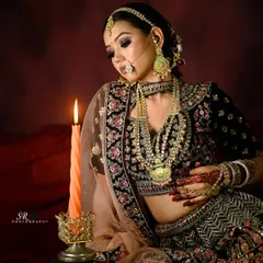 Creating a mood with light and shadow for a bridal portfolio. This shot highlights the intricate details of the lehenga and jewelry, creating a timeless and dramatic portrait.