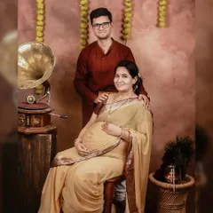 Including your partner in the maternity photoshoot adds another layer of love and connection to the portraits. Here's a beautiful moment from a traditional themed session.