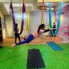 This is what we call flying. The Superman pose in aerial yoga is a powerful core and back strengthener that makes you feel truly weightless. It's a favorite in our classes for building strength and having fun.