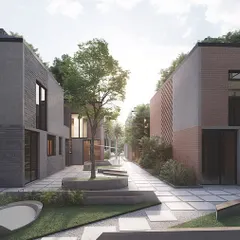 A view of a pedestrian-friendly lane within the Kolgaon Masterplan, flanked by townhouses with varied material palettes. The central green space with integrated seating and art creates a focal point for the neighborhood cluster.