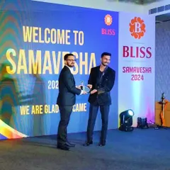 Receiving a token of gratitude from Bliss, a well-known pharma company, after my performance at their "Samavesha 2024" event. I created a sand art show depicting their 40-year journey.