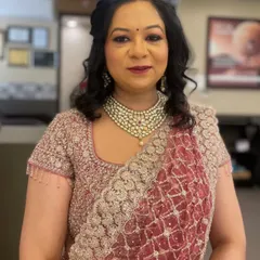 A beautiful glam makeup look by one of our senior artists. The client is ready for her event with a perfectly blended eyeshadow and a bold lip.