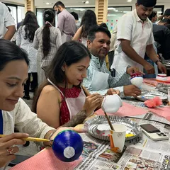 So much focus and creativity in one room! Pot painting is a relaxing and meditative activity that allows for individual expression within a group setting.