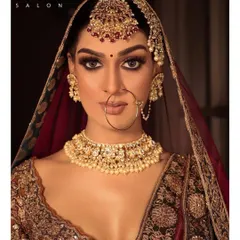 A captivating look for the modern bride. Here, we've focused on dramatic eye makeup with full lashes and a perfectly defined brow to create a powerful and memorable bridal statement.