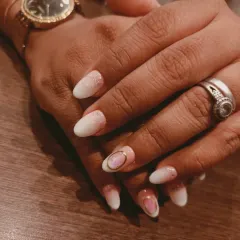 A closer view of the baby ombre nails, showing the seamless blend and the delicate gold ring detail on the accent nail.