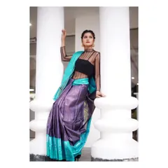 This shot uses strong architectural lines and a modern, sheer blouse to give a contemporary edge to a traditional Kanchipuram silk saree. It shows how I blend classic and modern elements in my commercial photography.