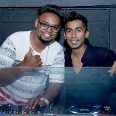 Posing with another DJ during a back-to-back set. Collaborating with other artists brings a fresh and dynamic energy to the party.