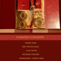 A look inside our traditional "Home Celebration Box" for Diwali. It's curated with a sweet box, dry fruits, clay diyas, an incense holder, and sparklers for a complete festive experience.